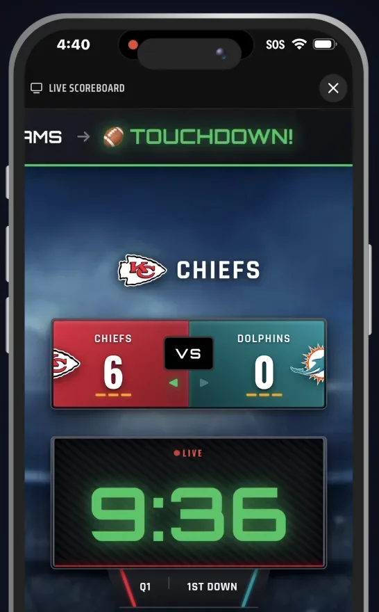 The live scoreboard on a phone: Chiefs 6, Dolphins 0, 9:36 in the first quarter, a touchdown banner across the top